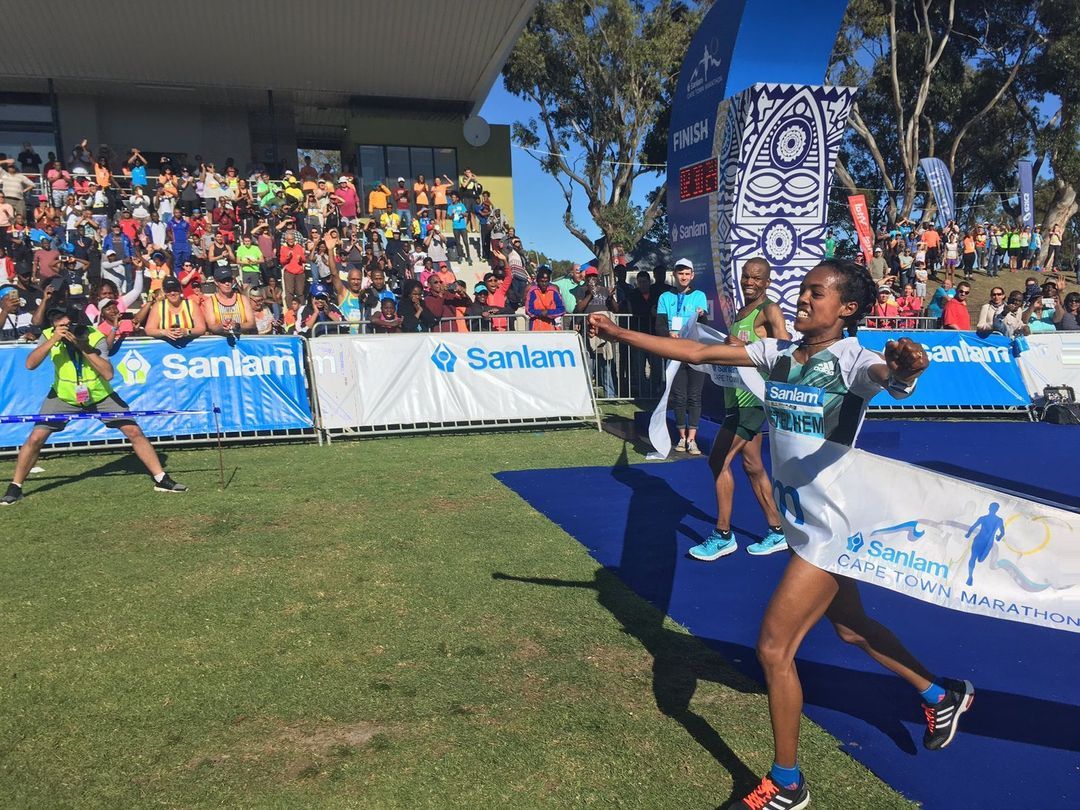 Sanlam-branded event activation with an athlete competing on a blue running track