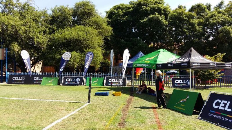 Outdoor community event activation with branded gazebos and signage